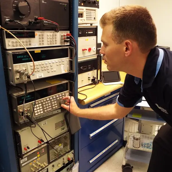 Rick Hogan calibrating equipment in A2LA accredited lab